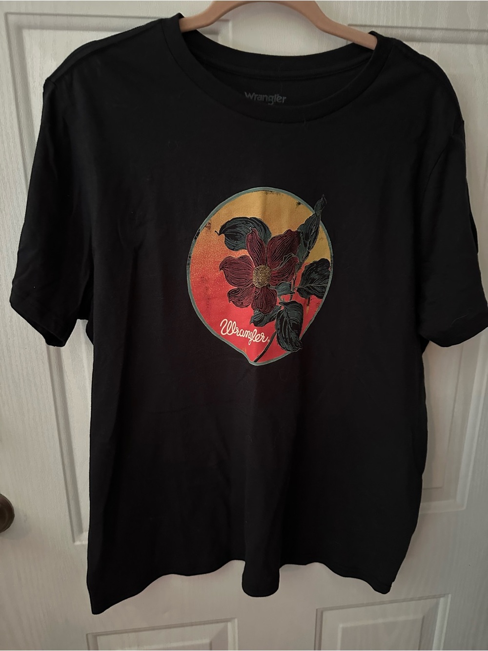 Wrangler Black Tee with Sunset Floral Emblem